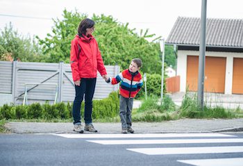 Mother and son practicing road safety
